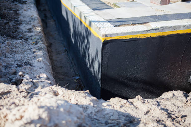 Professional Basement Waterproofing technician working in Gibbstown, NJ